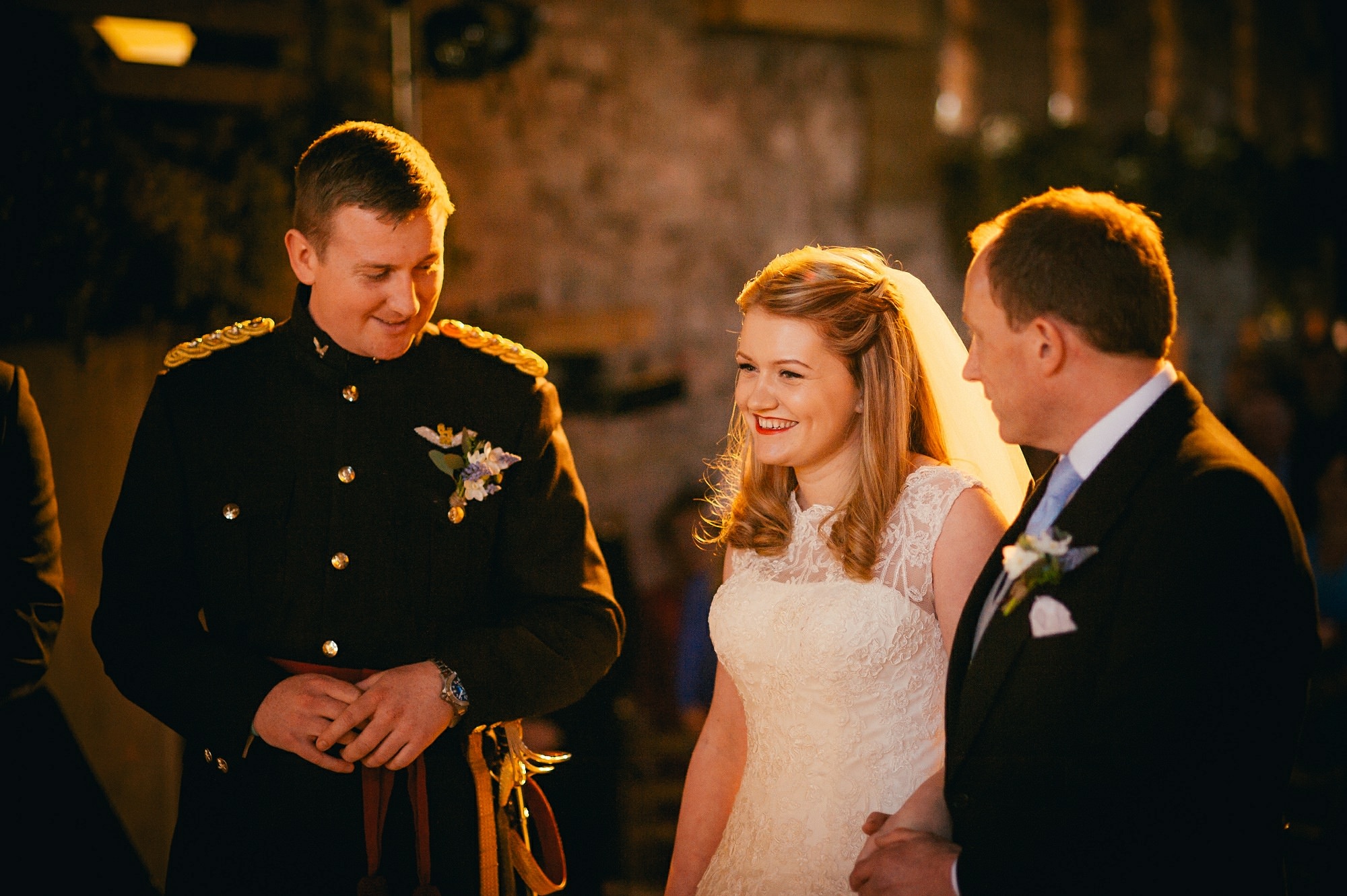 military groom with bride during ceremony 