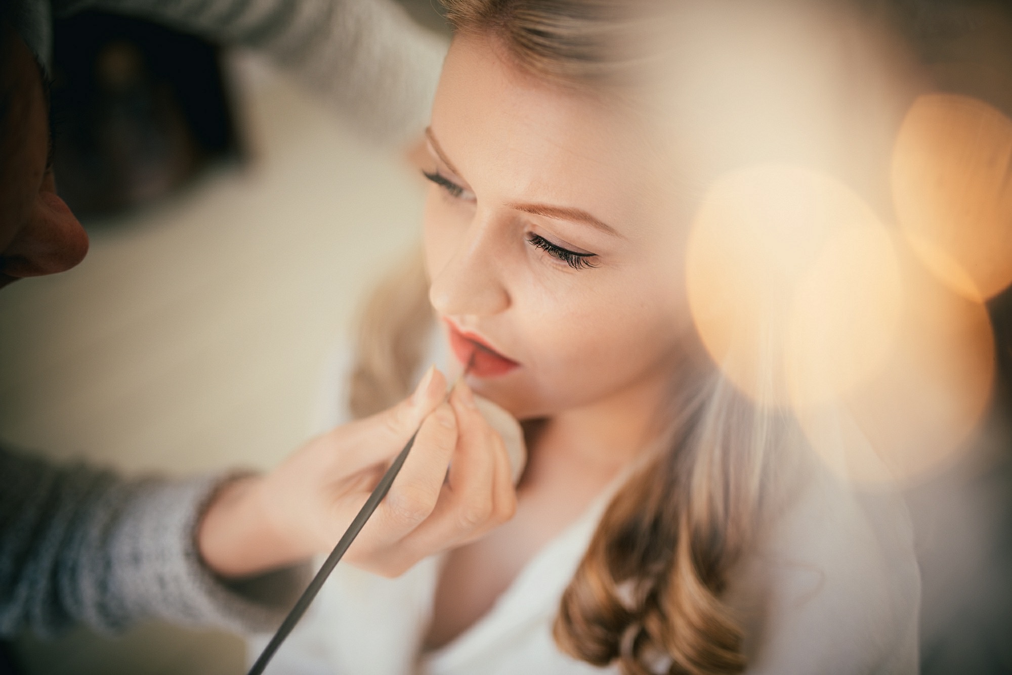 bride having make up done