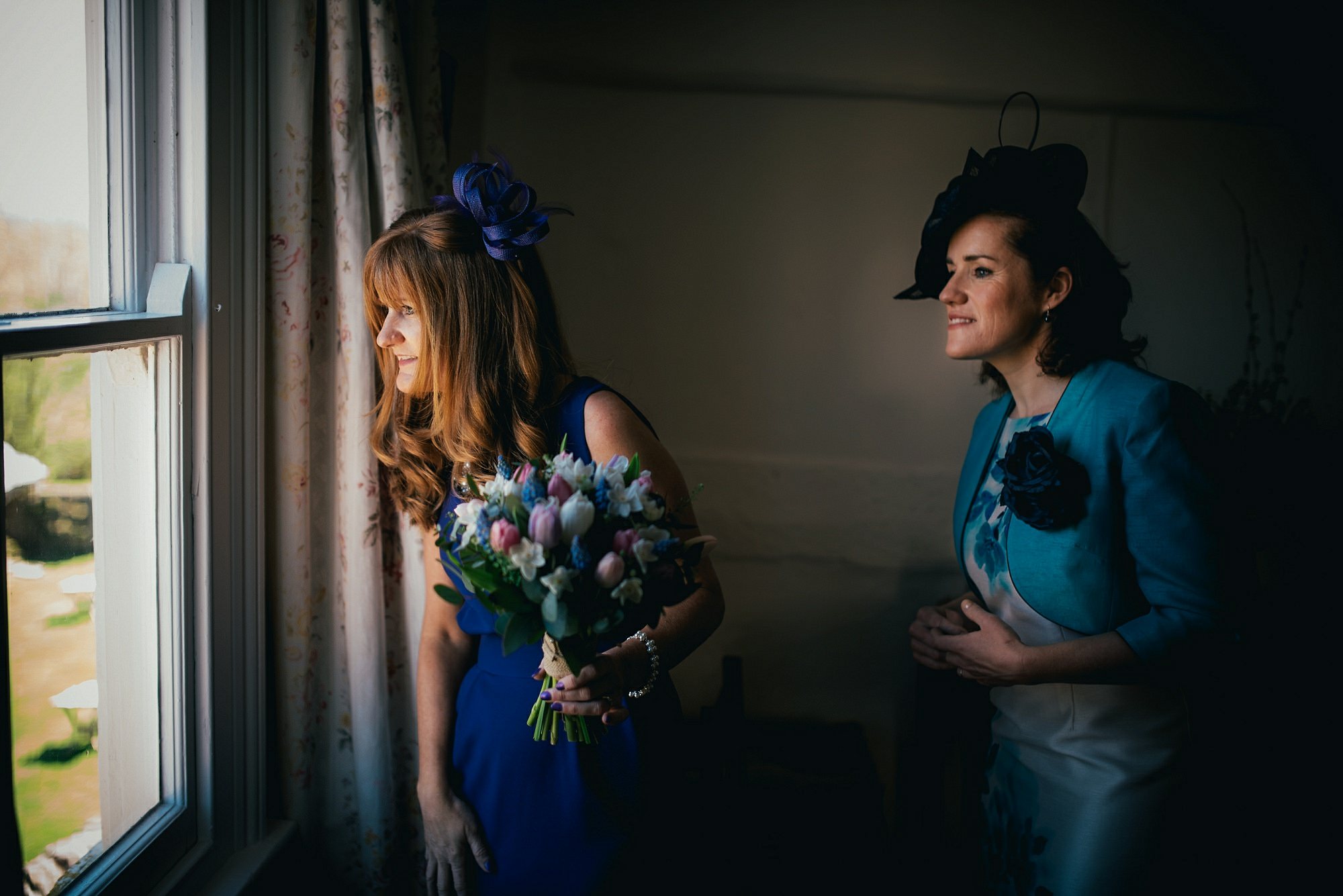 mum's looking out of wedding at daughters wedding
