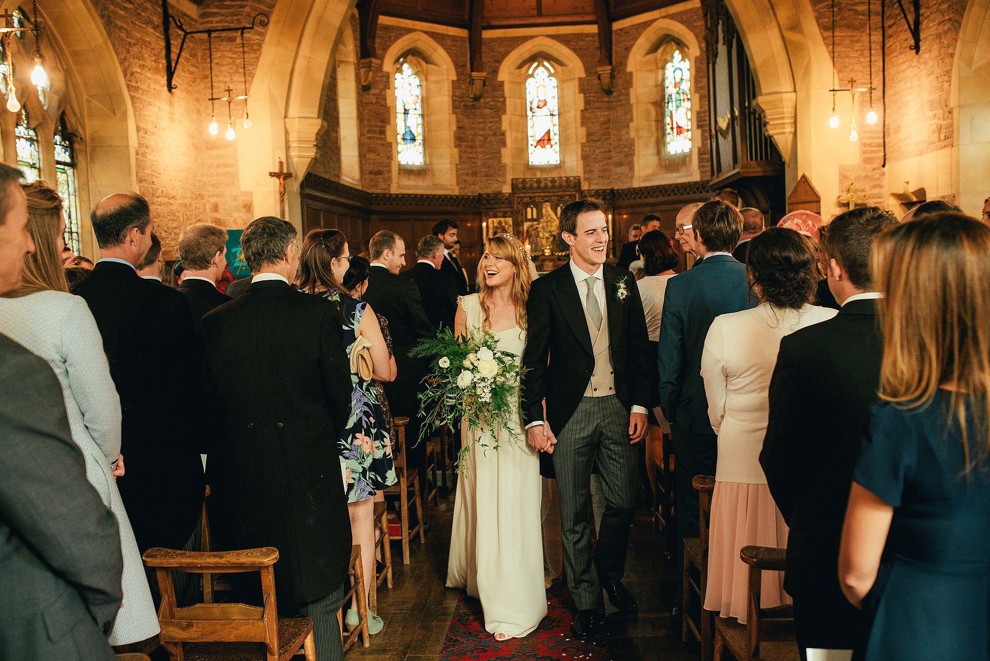 bride and groom happy exit from church