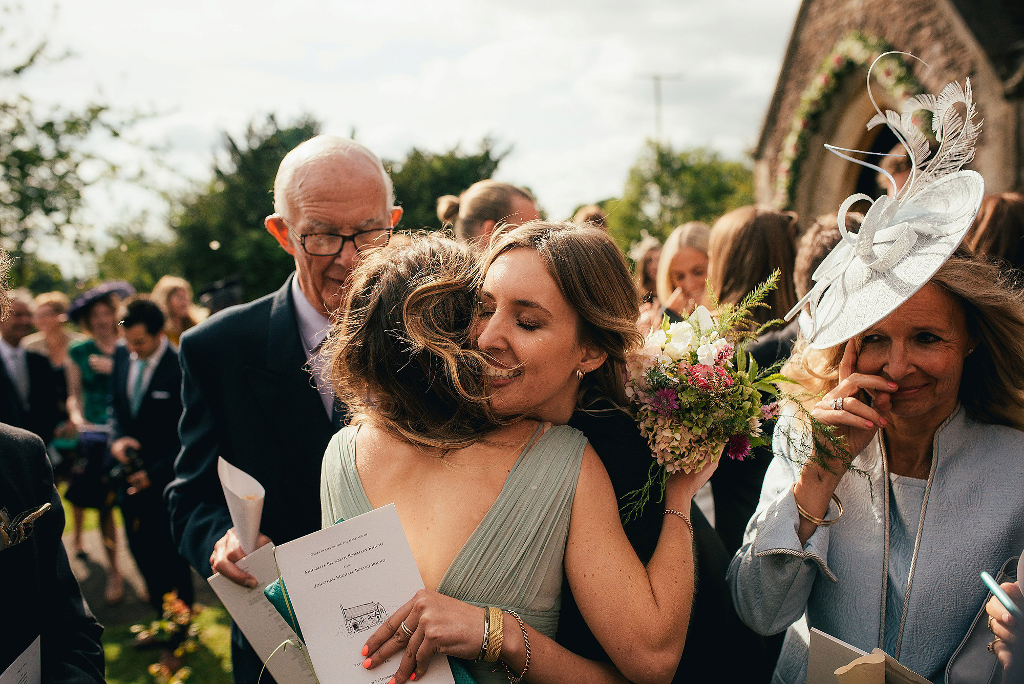 wedding guests hugging