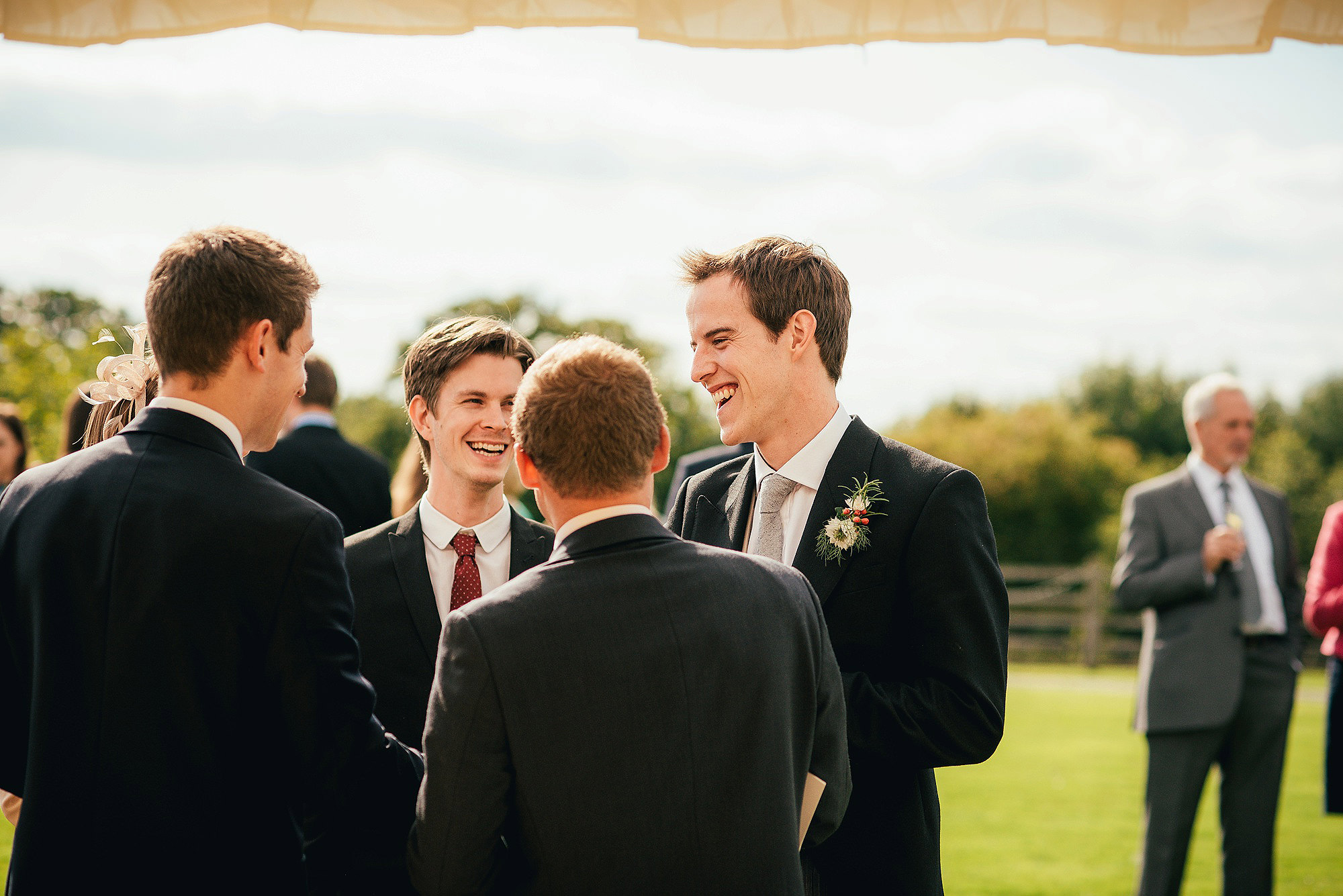 groom laughing with friends